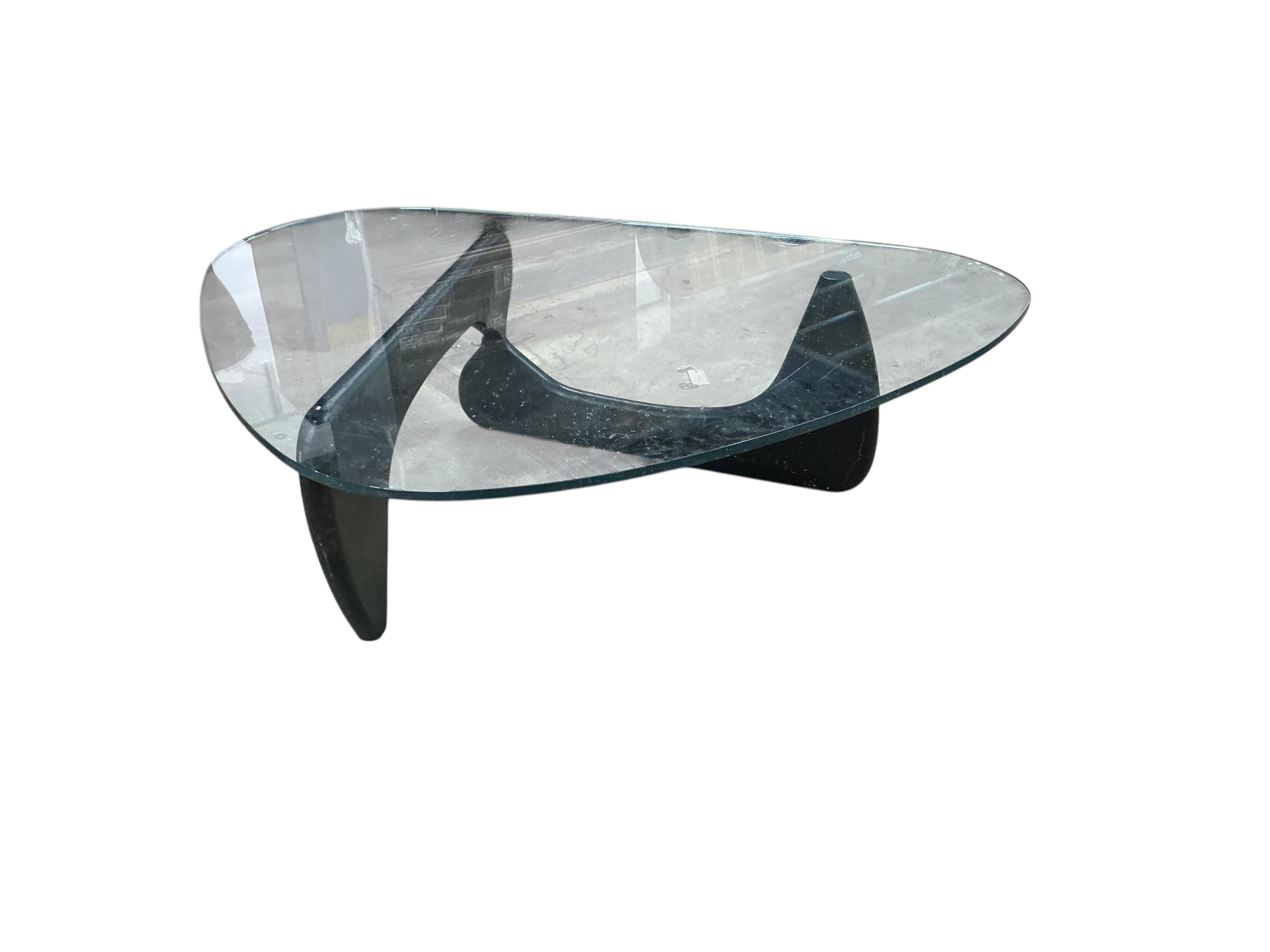 A mid century Isamu Noguchi ebonised glass top coffee table, width 114cm, depth 107cm, height 40cm